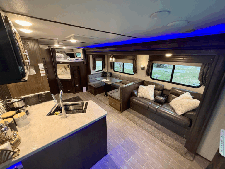 RV living room in Puerto Vallarta with leather sofa bed and air conditioning